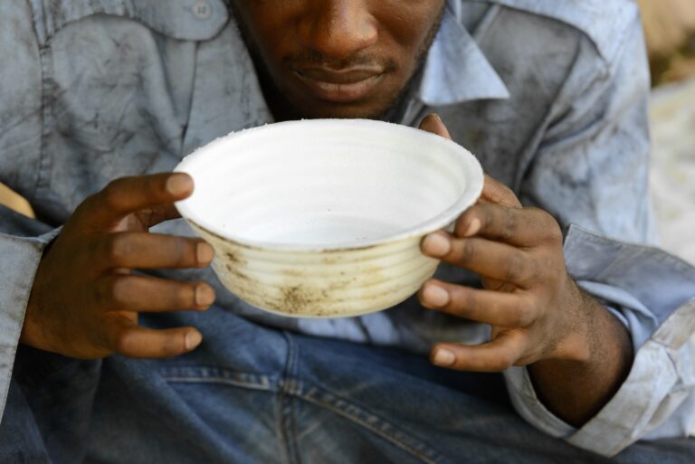 hands-of-young-homeless-african-man-begging-for-food